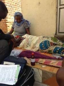 Dr. Ludo giving morphine to a patient in a pain crisis